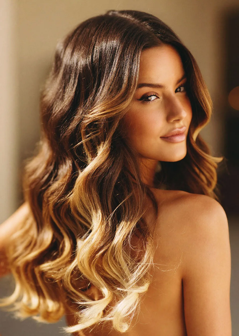 Luxury blonde balayage with seamless ribbons, soft movement, and healthy shine.