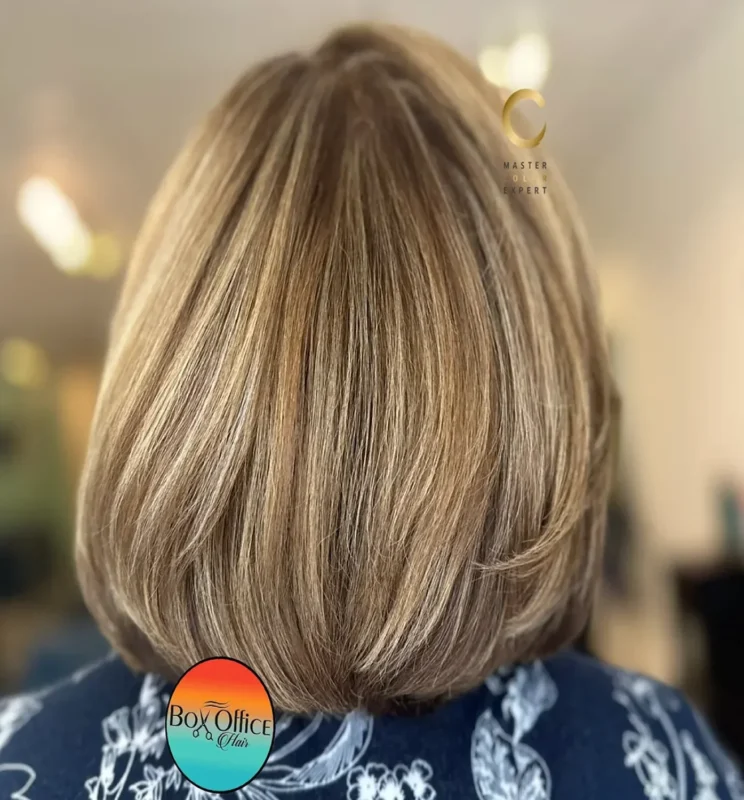Dimensional blonde bob haircut with seamless beige blonde highlights and precision shaping by Box Office Hair in Winter Springs, Florida.