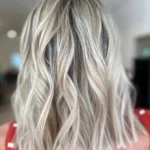 icy blonde hair color with dimensional tone, polished movement, and reflective shine