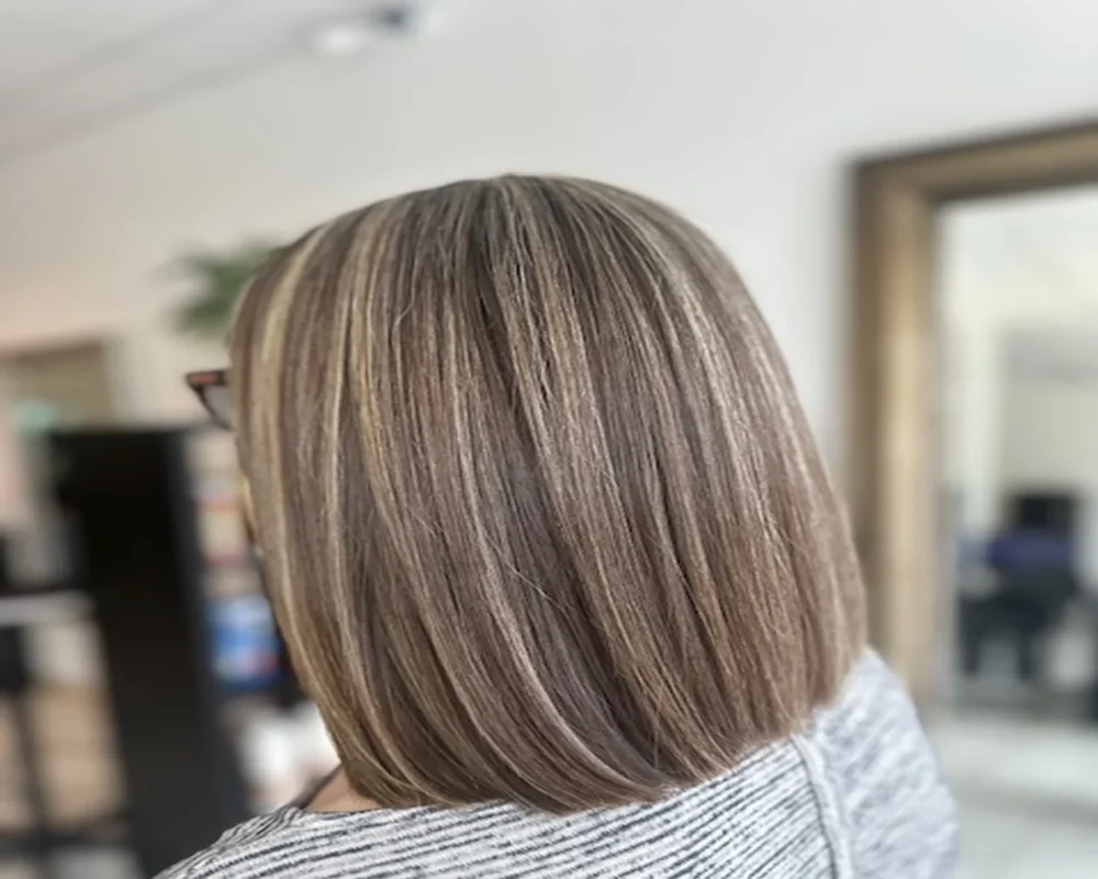 Smooth, healthy hair with dimensional shine, silky texture, and frizz-free finish after a professional hair treatment.